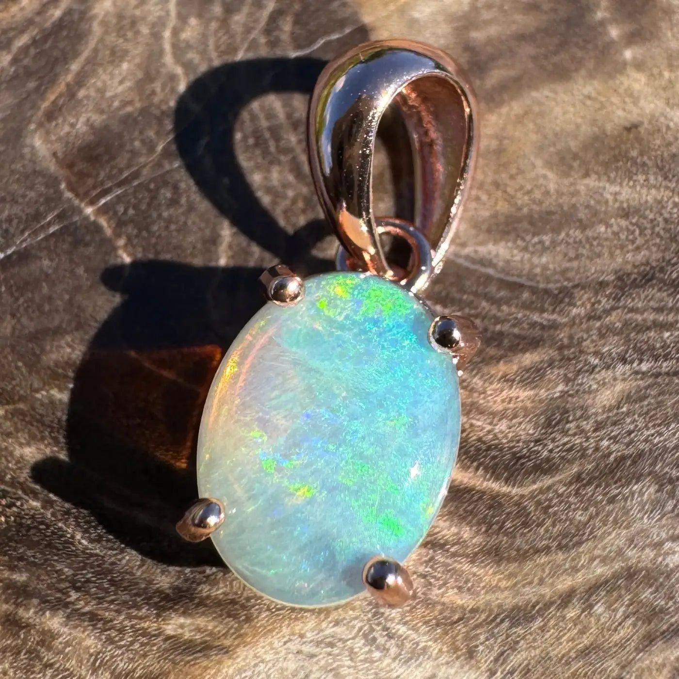Oval opal pendant with rose gold setting from the Great Ocean Drift collection