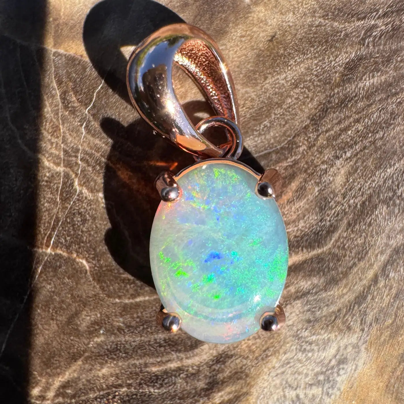 Oval opal pendant with rose gold setting in the Great Ocean Drift handcrafted jewelry collection