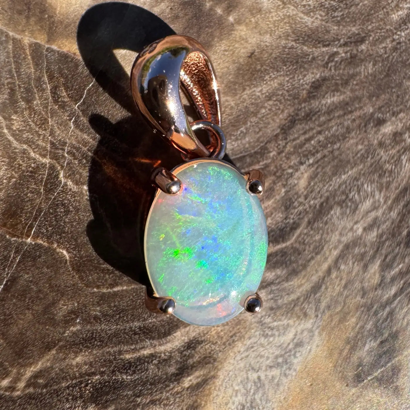 Oval Lightning Ridge Crystal Opal pendant with rose gold setting in sterling silver
