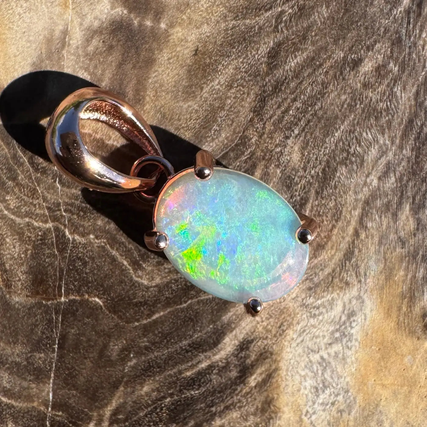 Oval opal pendant with rose gold setting in the Great Ocean Drift handcrafted jewelry collection