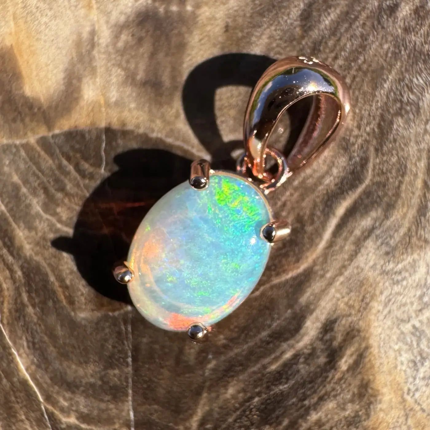 Oval opal pendant with rose gold setting from the Great Ocean Drift collection