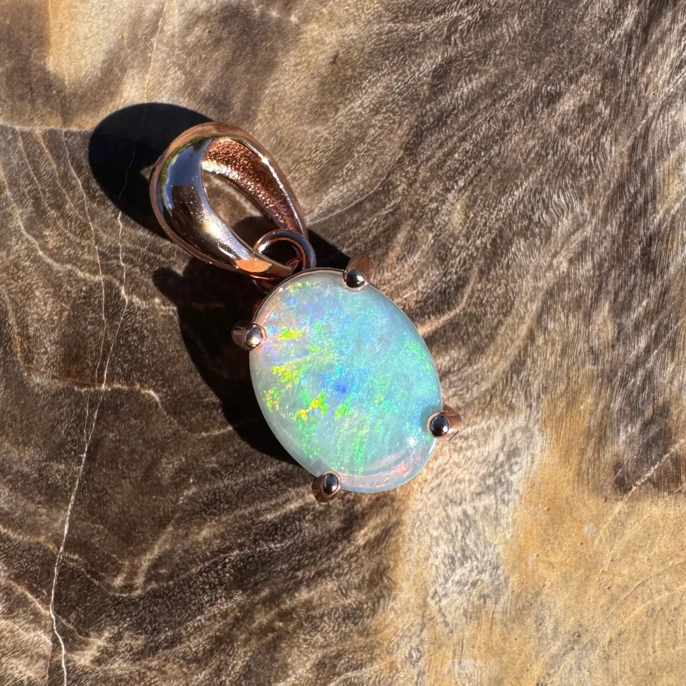 Oval opal pendant with rose gold setting in the Great Ocean Drift handcrafted jewelry collection