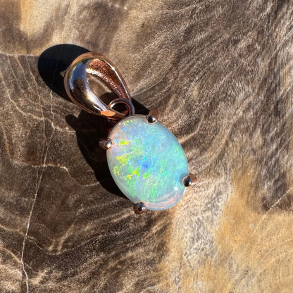 Oval opal pendant with rose gold setting in the Great Ocean Drift handcrafted jewelry collection