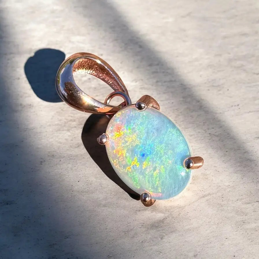 Oval opal pendant with rose gold setting in the Great Ocean Drift handcrafted jewelry collection