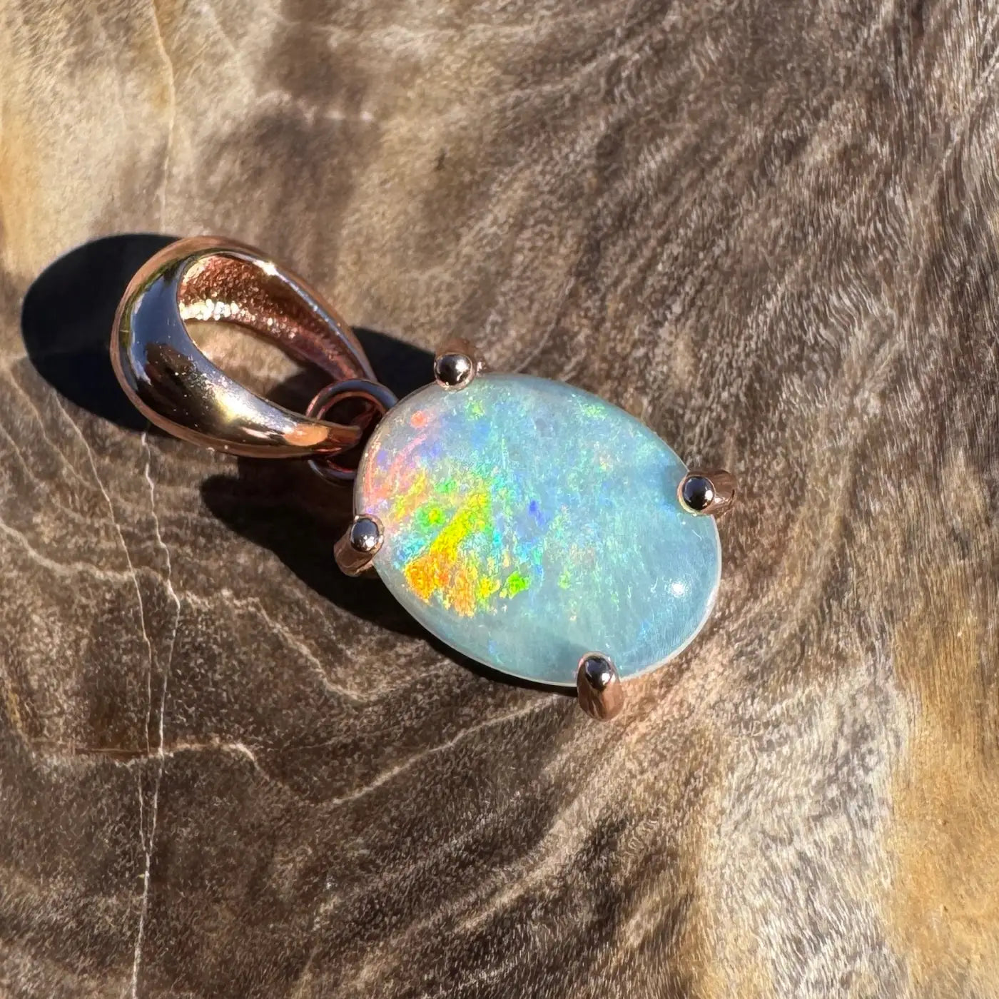 Rose gold opal pendant from Great Ocean Drift featuring 0.9ct Lightning Ridge Crystal Opal