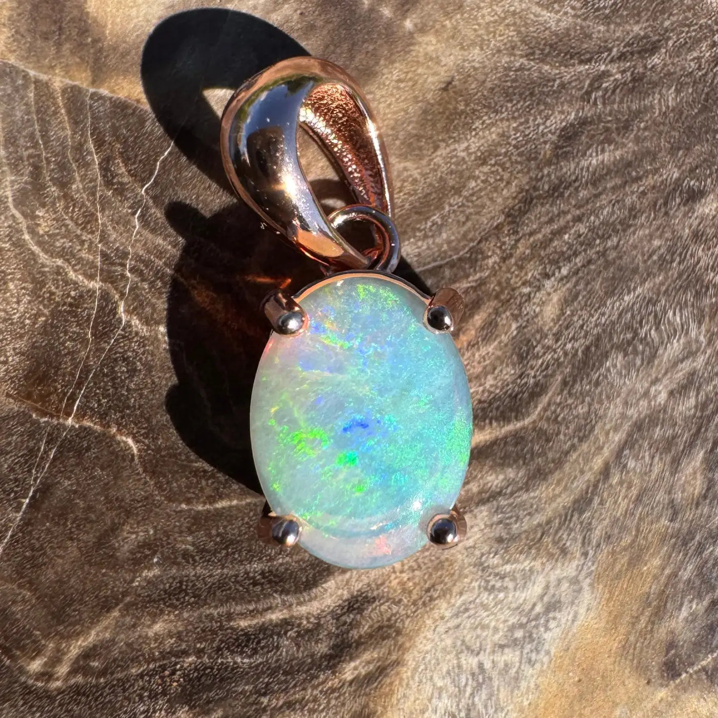 Oval opal pendant with rose gold setting in the Great Ocean Drift handcrafted jewelry collection