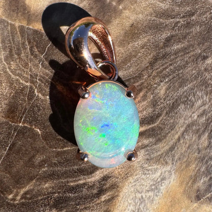 Oval opal pendant with rose gold setting in the Great Ocean Drift handcrafted jewelry collection