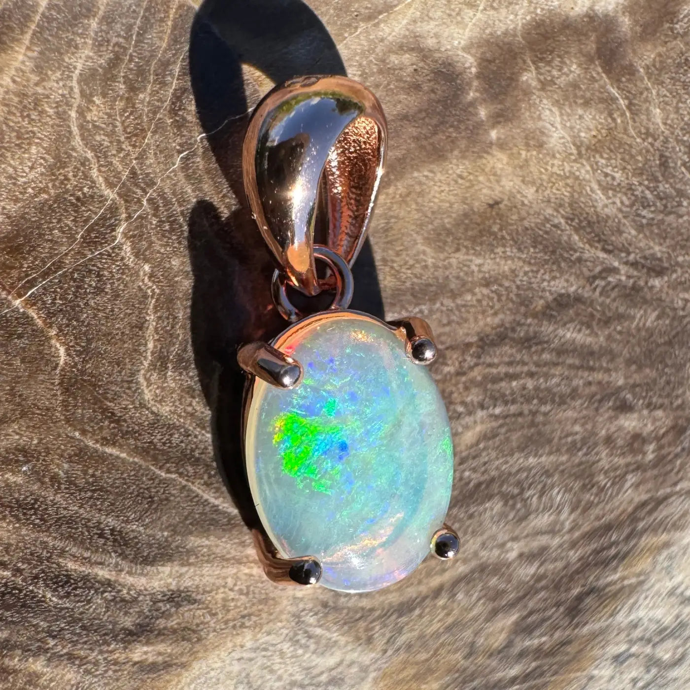 Rose gold opal pendant from Great Ocean Drift crafted with Lightning Ridge crystal opal