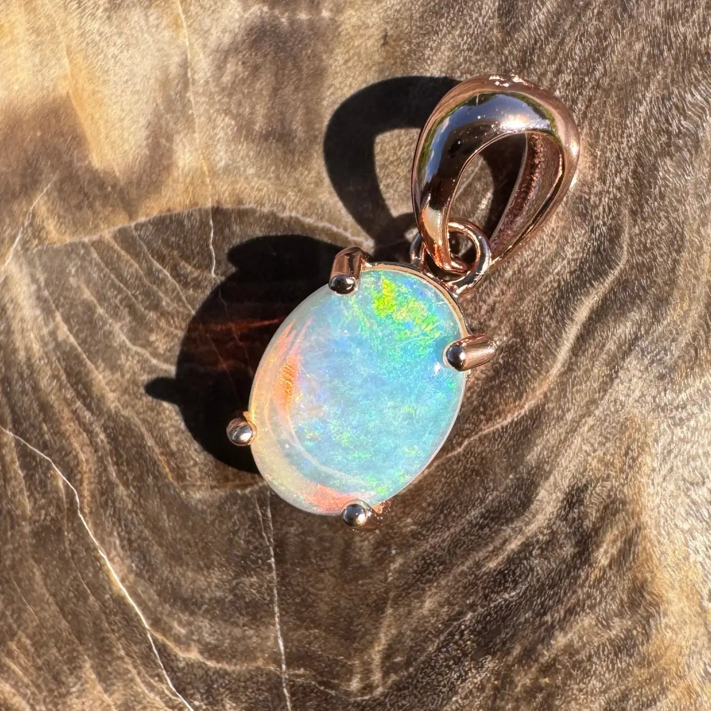Oval opal pendant with rose gold setting from the Great Ocean Drift collection