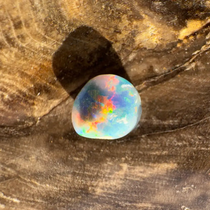 Iridescent opal gemstone from Hand-Cut Solid Lightning Ridge Black Opal 0.9 carat