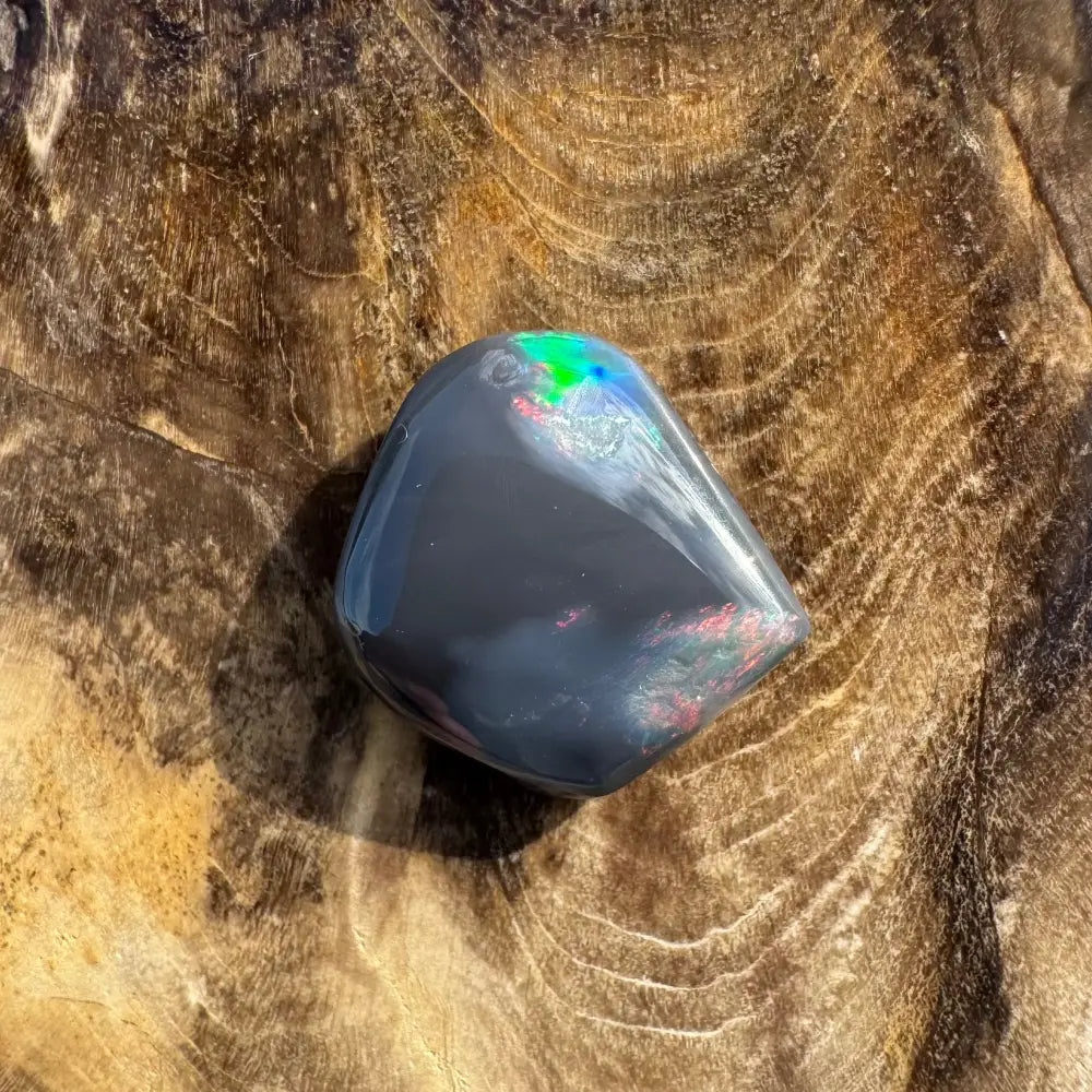 Polished Black Opal with iridescent flashes from Lightning Ridge in a 4.0-carat Hand-Cut Solid specimen