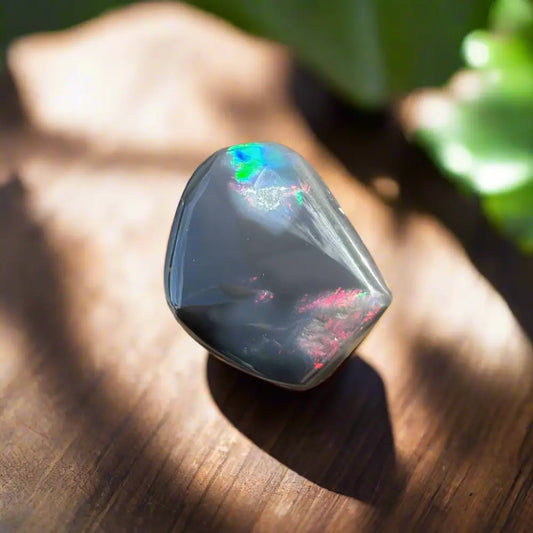 Polished black opal with iridescent flashes from Lightning Ridge, 4.0 carats