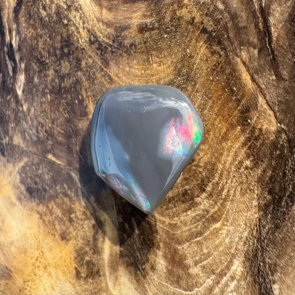 Polished gray Lightning Ridge Black Opal with iridescent flashes in a 4.0-carat hand-cut gemstone
