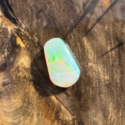 Iridescent Lightning Ridge Crystal Opal gemstone showcased in a 1.0 carat hand-cut jewelry piece
