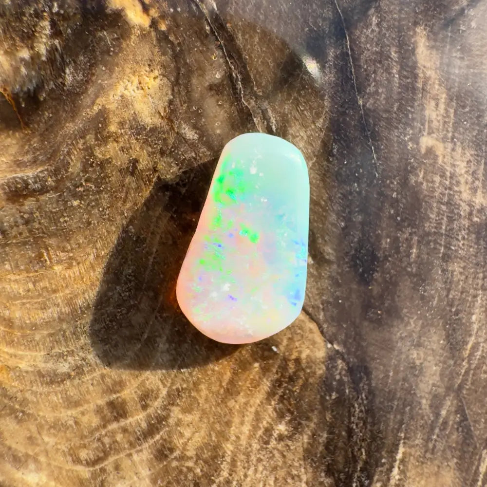 Hand-cut Solid Lightning Ridge Crystal Opal showing iridescent play of colors