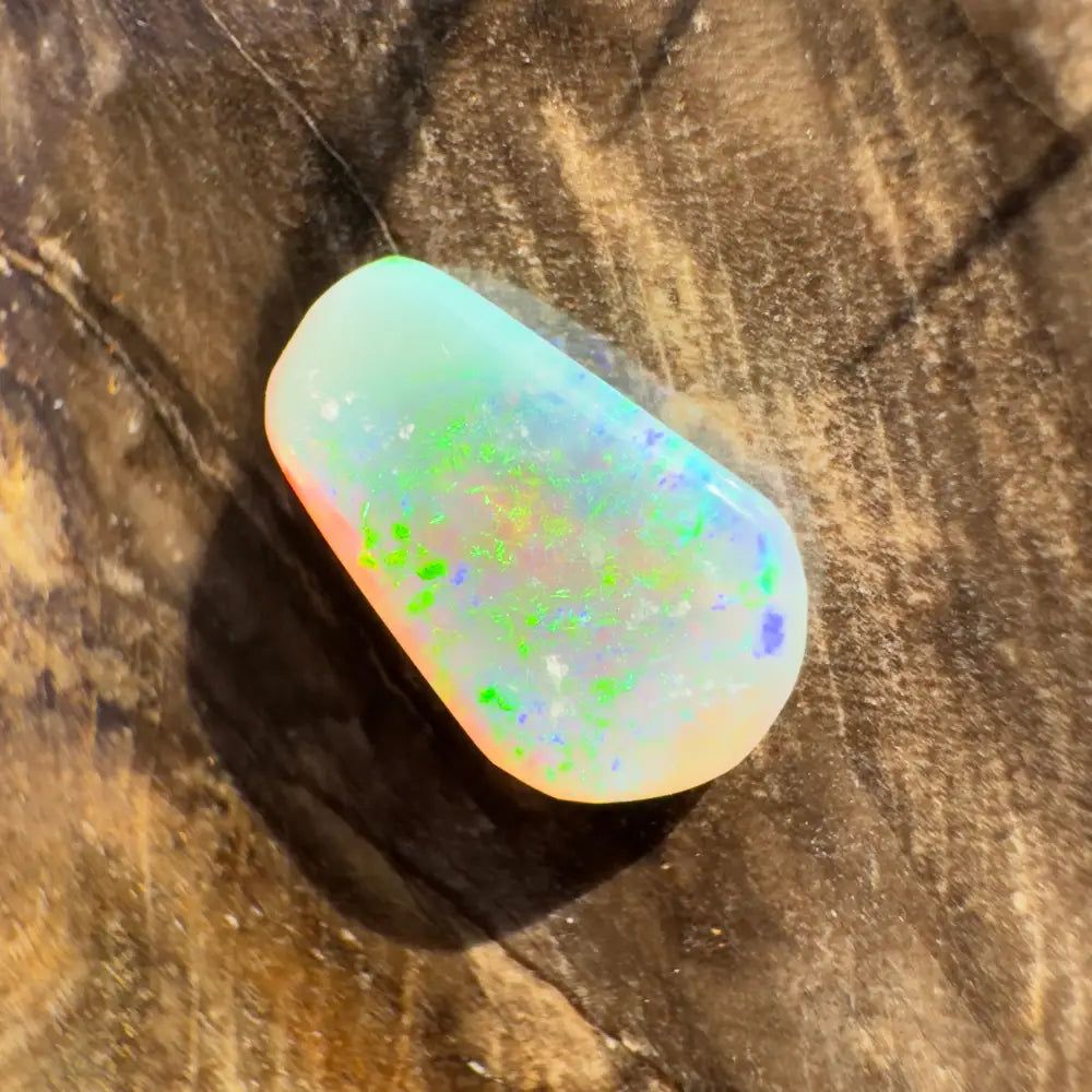 Iridescent Lightning Ridge Crystal Opal gemstone in a hand-cut 1.0 carat display