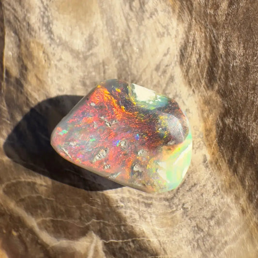Polished Lightning Ridge Nobby Opal with vibrant color play in a 4.1 carat hand-cut design