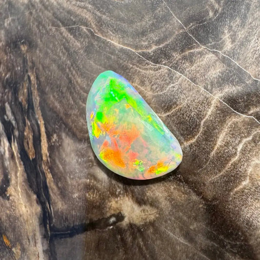 Iridescent Opal gemstone from Lightning Ridge in a Hand-Cut Solid 1.5 Carat Product