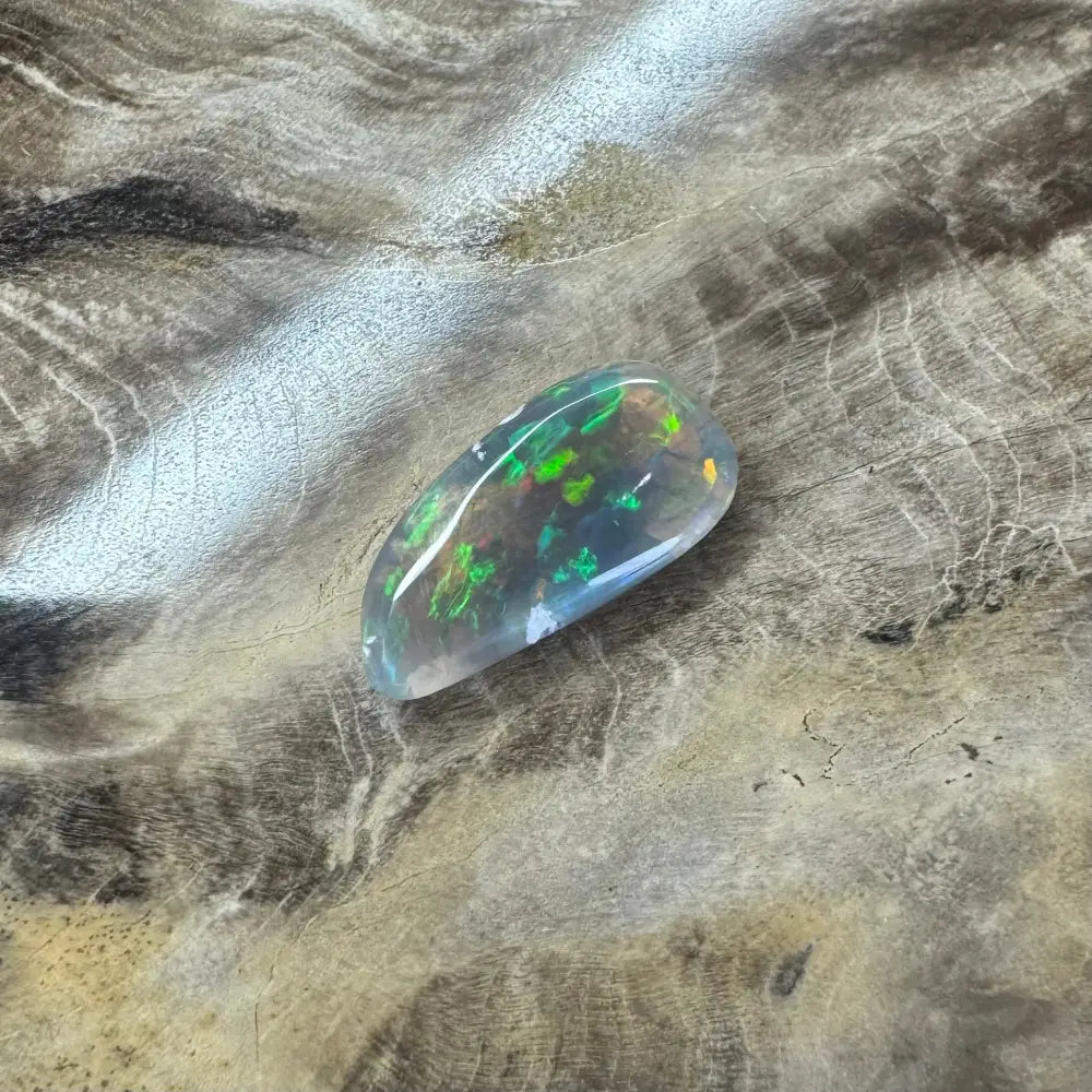 Iridescent opal gemstone in the Hand-Cut Solid Lightning Ridge Opal 2.6 carat jewelry piece