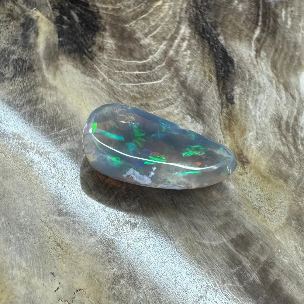 Iridescent Opal gemstone from Lightning Ridge in a Hand-Cut Solid 2.6 Carat setting