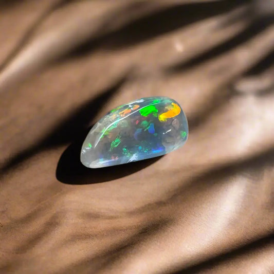 Hand-cut Solid Lightning Ridge Opal 2.6 carats with iridescent opal gemstone display