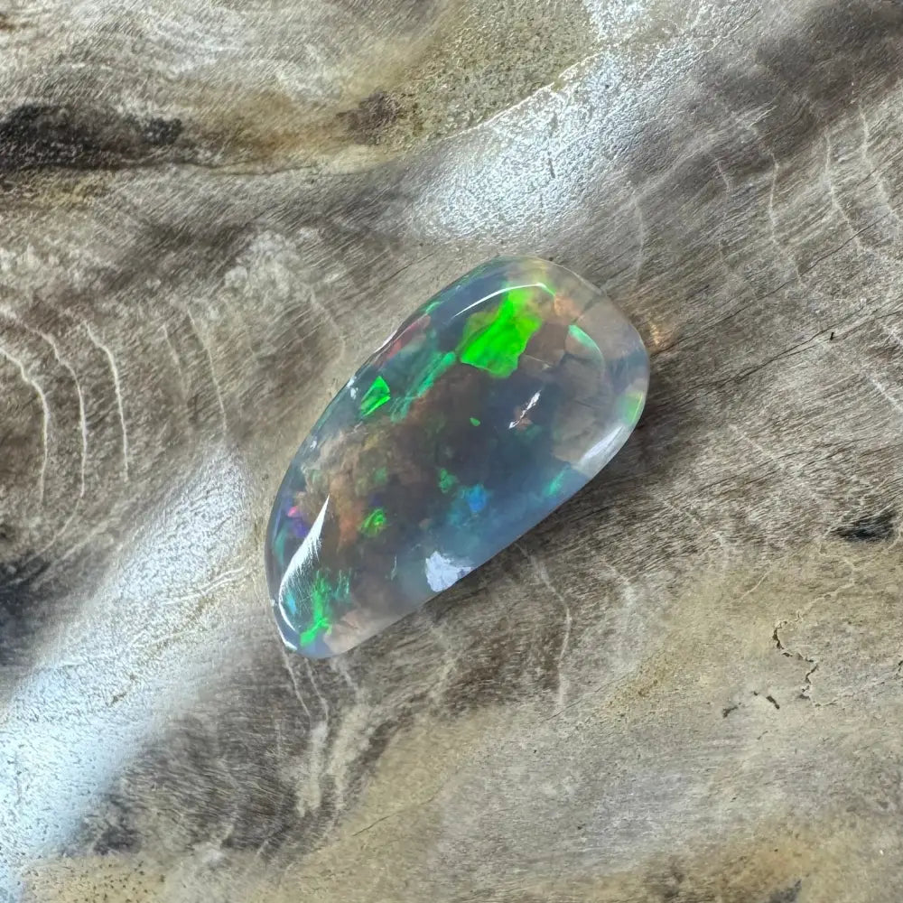 Iridescent Lightning Ridge Opal gemstone displayed in the Hand-Cut Solid 2.6carat product