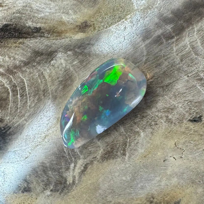 Iridescent Lightning Ridge Opal gemstone displayed in the Hand-Cut Solid 2.6carat product