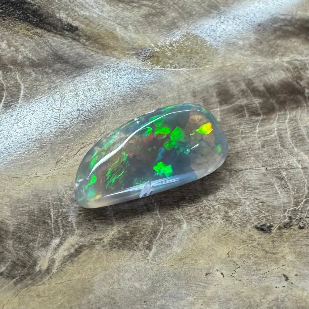 Hand-cut Lightning Ridge Opal showcasing vibrant iridescent colors and unique patterning