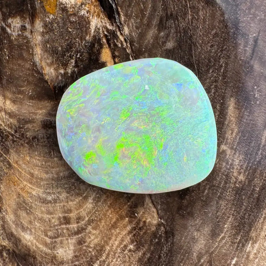 Iridescent Lightning Ridge Opal gemstone in a hand-cut 5.7 carat form