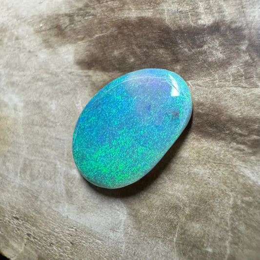 Iridescent blue-green opal cabochon from Hand-Cut Solid Lightning Ridge Semi Black Opal 2.0 carats