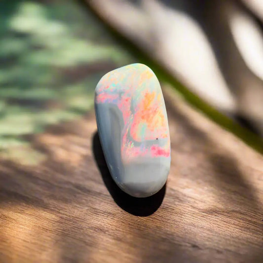 Polished lightning ridge semi black opal gemstone from the Hand-Cut Solid Opal collection