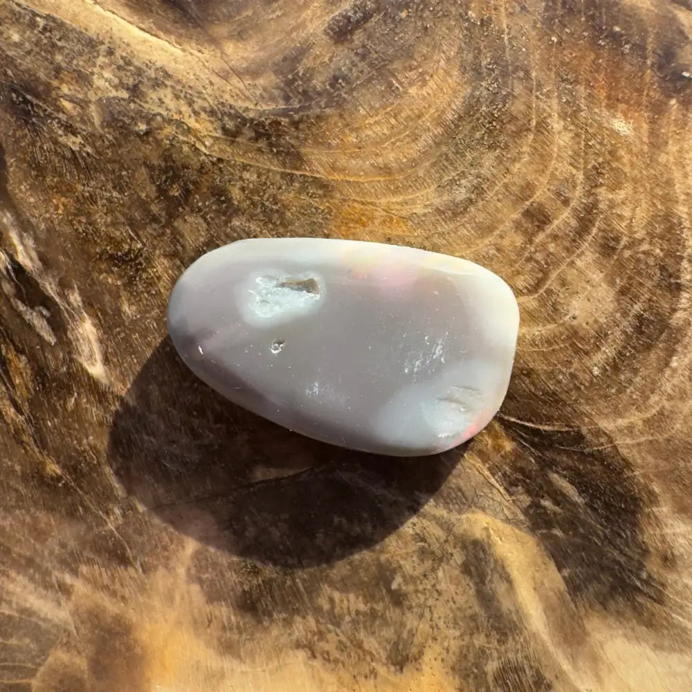 Polished gray agate with small geode as part of Hand-Cut Solid Lightning Ridge Semi Black Opal 2.8carat