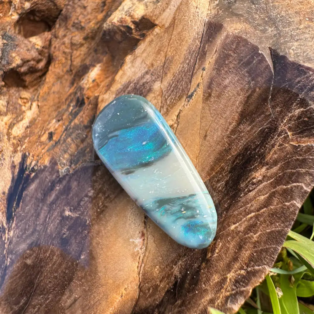 Polished blue and white semi-black Lightning Ridge Opal in a 4.9carat hand-cut gemstone