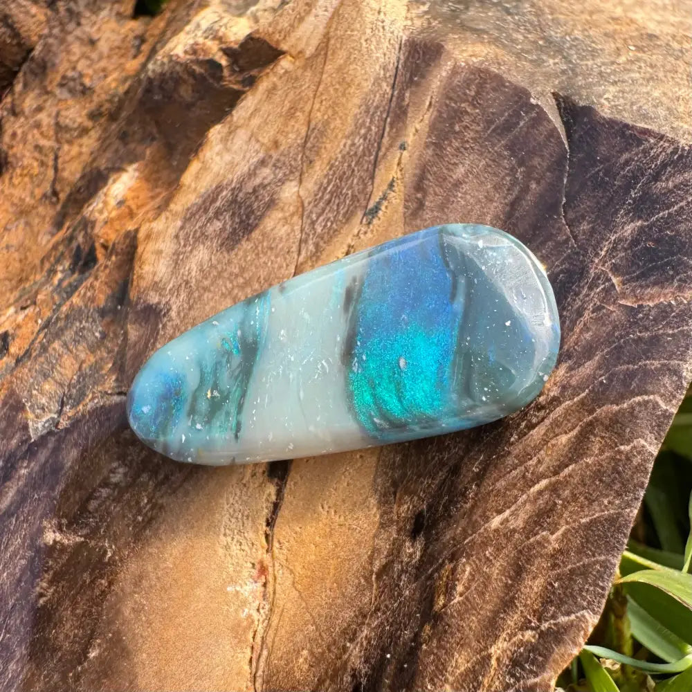 Polished Lightning Ridge semi black opal with blue and green iridescence, 4.9 carats