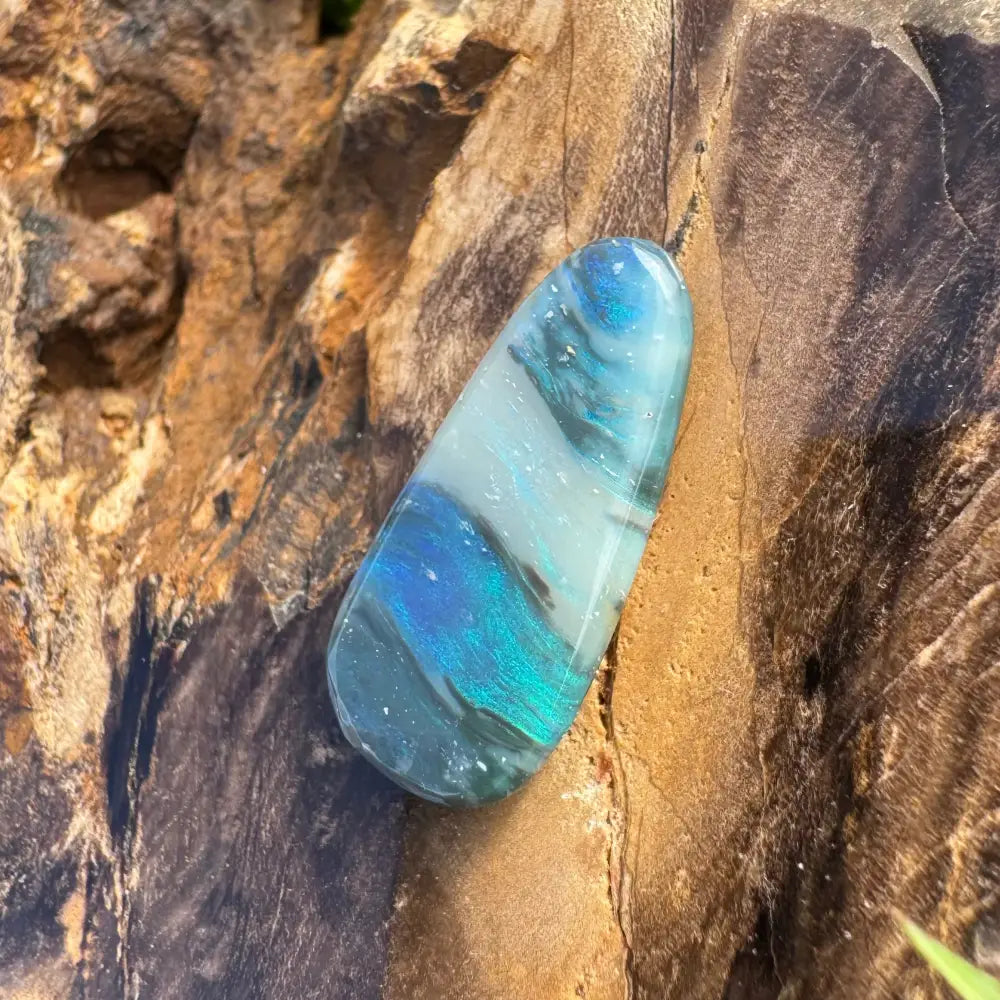 Iridescent blue and white polished Lightning Ridge semi black opal gemstone 4.9 carats