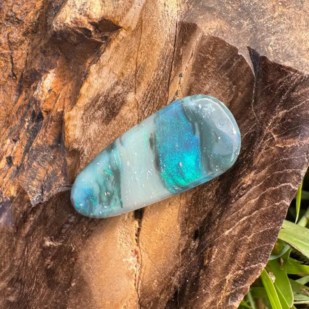 Iridescent blue and white opal cabochon in the Hand-Cut Solid Lightning Ridge Semi Black Opal 4.9carat