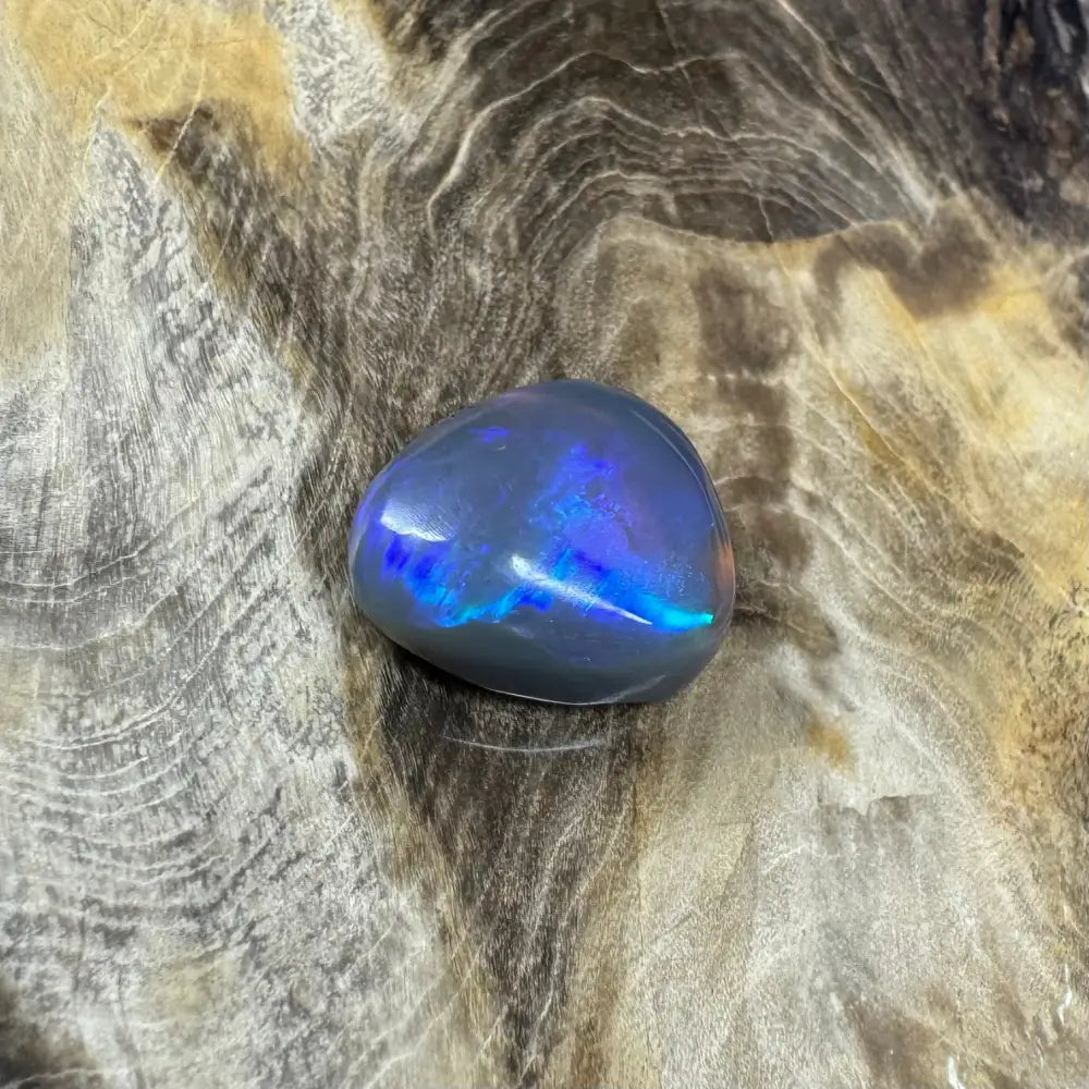 Iridescent blue-gray opal cabochon from Hand-Cut Solid Lightning Ridge Semi Black Opal 5.4 carats