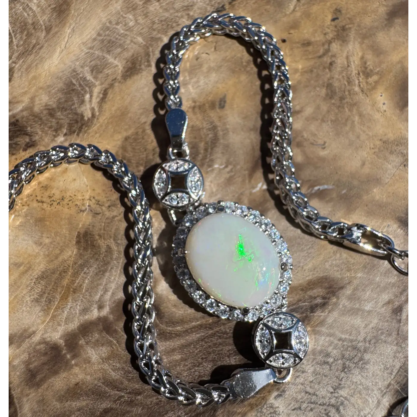 Silver necklace featuring a 1.1ct Coober Pedy Opal pendant and cubic zirconia