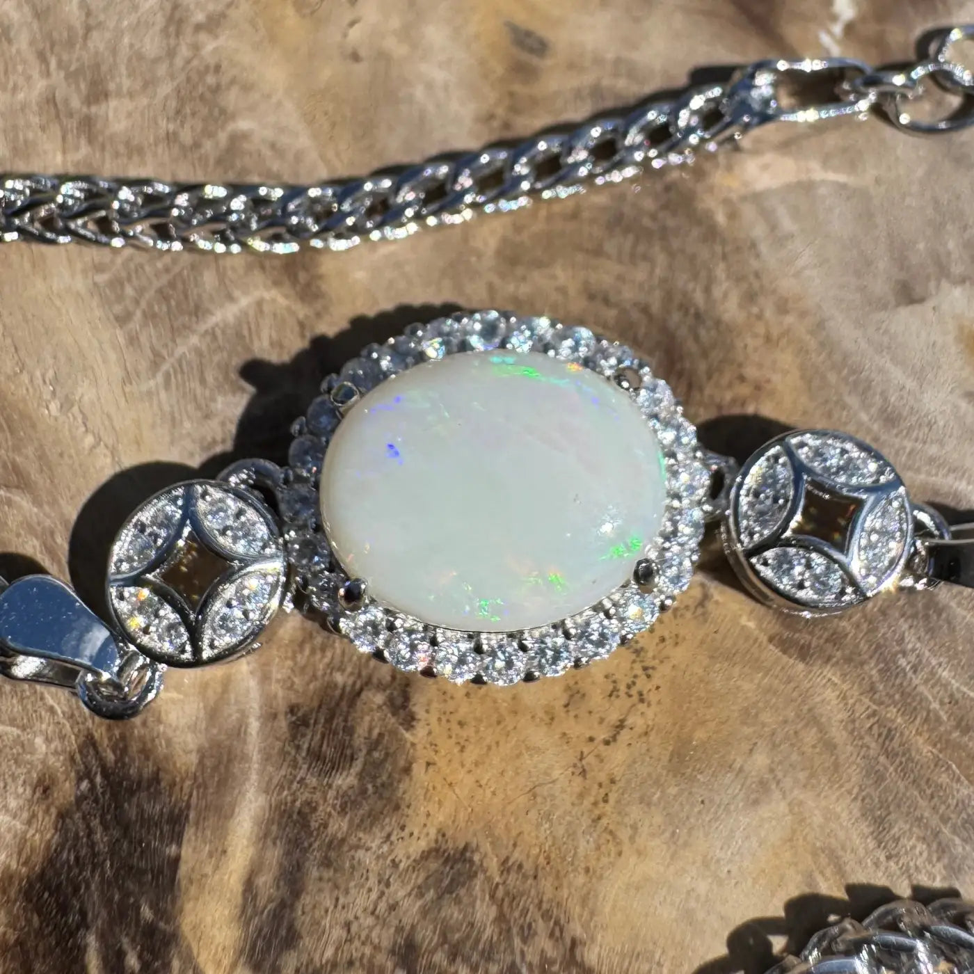Elegant handcrafted bracelet featuring a 1.1ct Coober Pedy opal and cubic zirconia in sterling silver