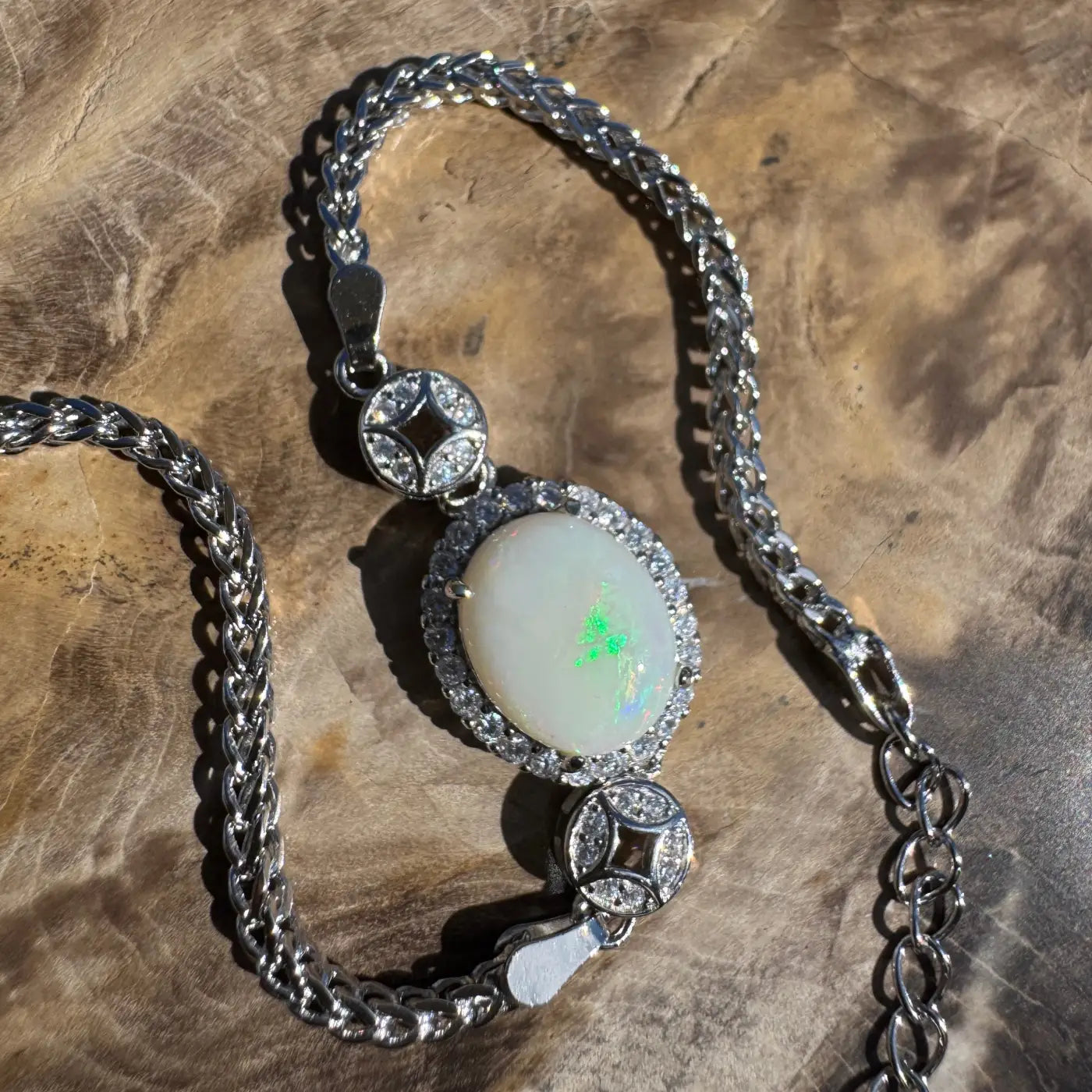 Silver chain bracelet featuring a 1.1 carat Coober Pedy Opal gemstone and cubic zirconia accents