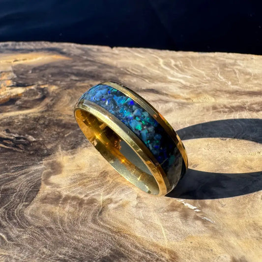 Gold ring with blue opal inlay from Handcrafted Australian Opal Ring Gold Surgical Steel Size X 1/2