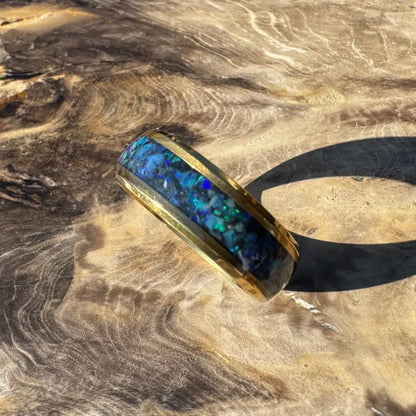 Gold ring with vibrant blue opal inlay in handcrafted Australian jewelry piece