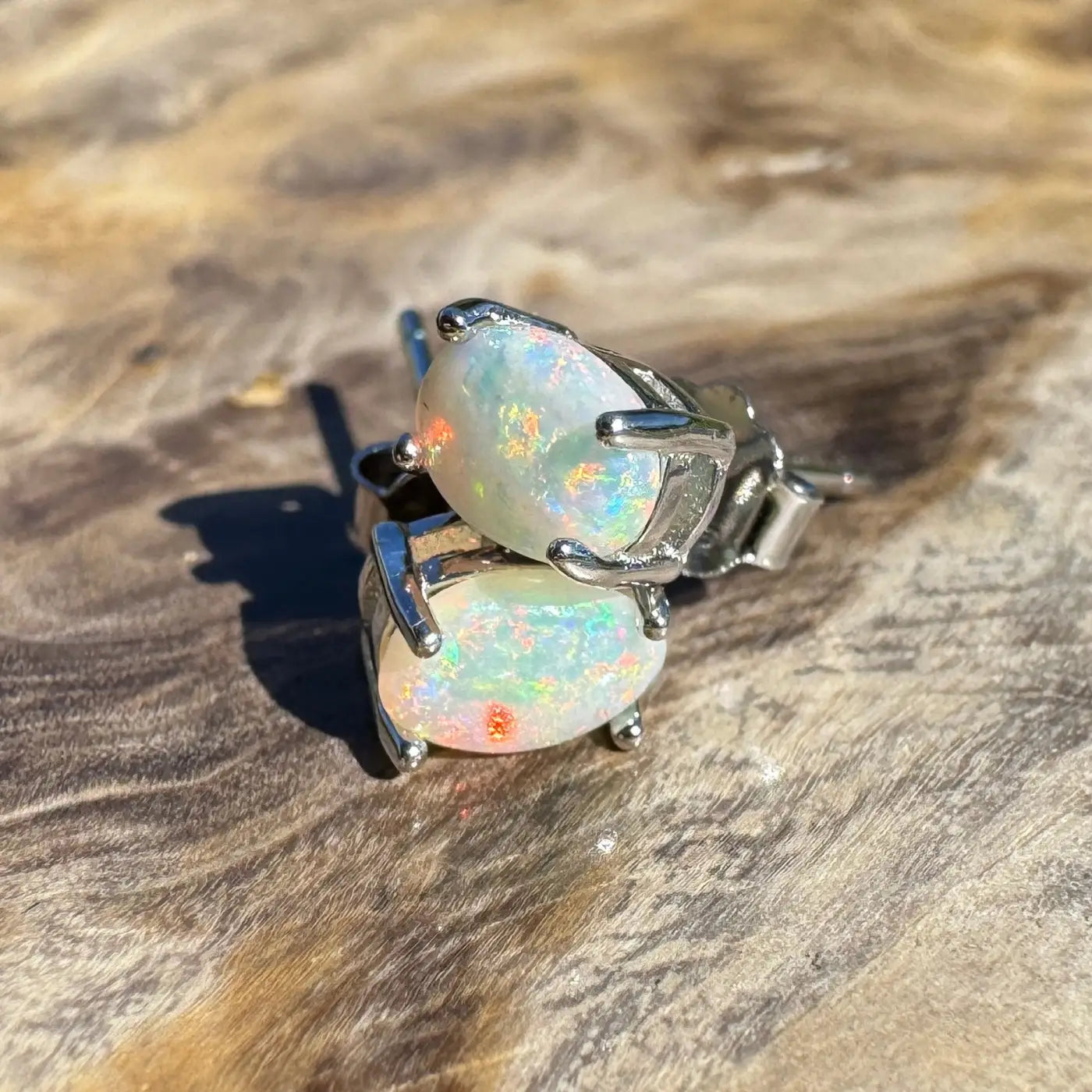 Opal stud earrings with silver prongs from Kimberley Blaze handcrafted Lightning Ridge opal jewelry