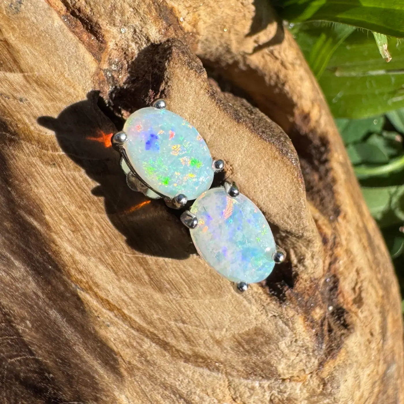 Oval opal earrings with silver prongs from Kimberley Blaze handcrafted Lightning Ridge Opal collection