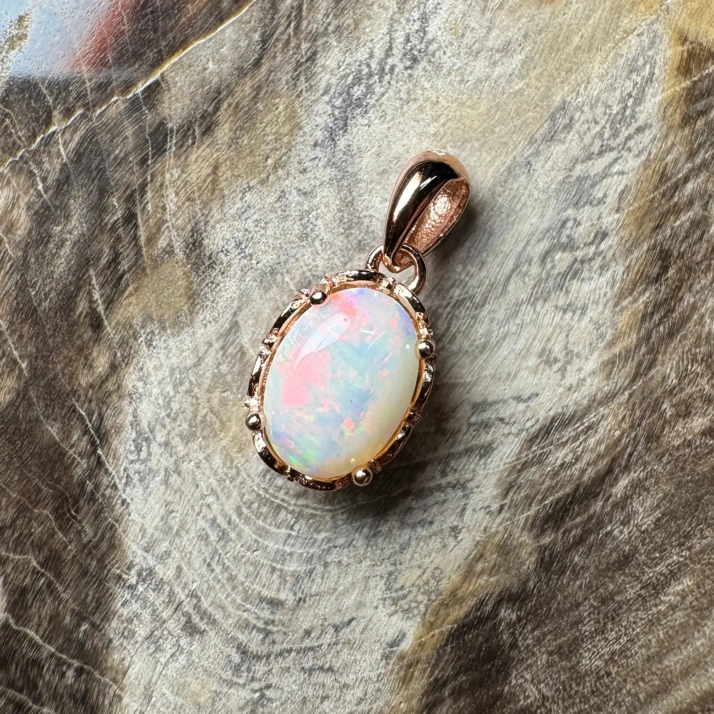 Rose gold opal pendant in 925 sterling silver with handcrafted Coober Pedy opal detail