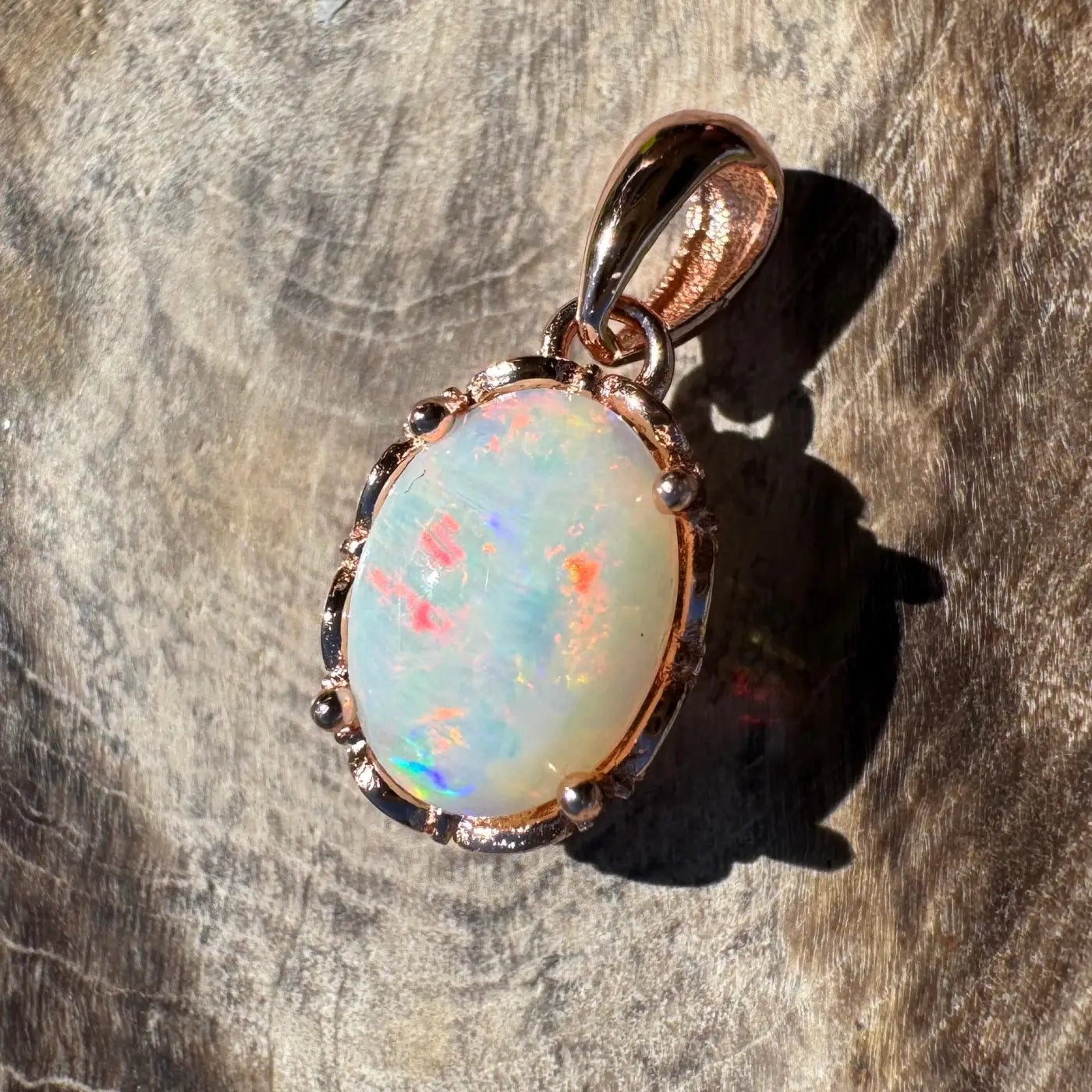 Oval opal pendant with rose gold setting from Larapinta Flame handcrafted sterling silver jewelry
