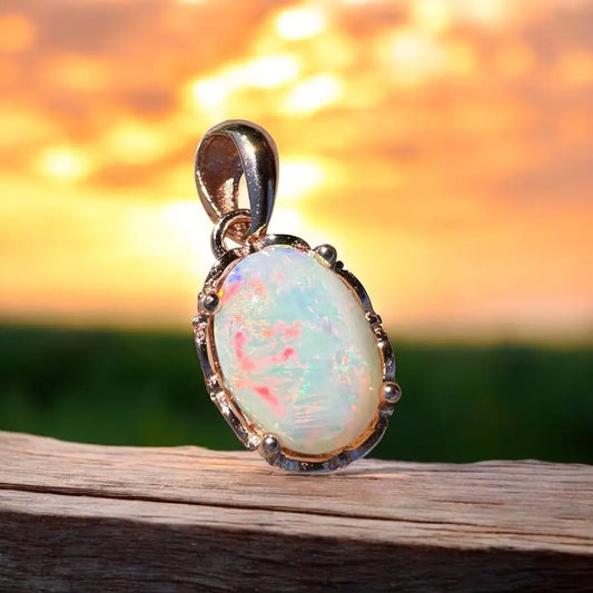 Oval opal pendant with silver setting from Larapinta Flame handcrafted Coober Pedy opal
