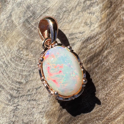 Oval opal pendant with rose gold setting in the Larapinta Flame handcrafted jewelry collection