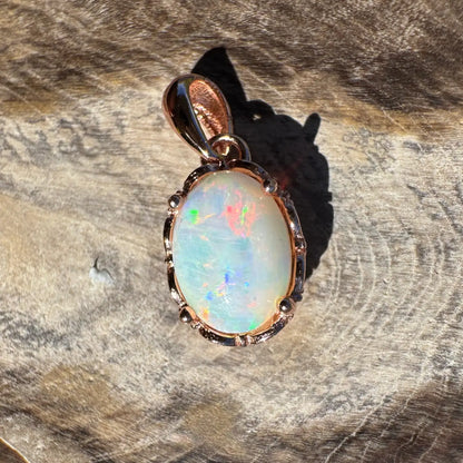 Oval Coober Pedy opal pendant with rose gold setting in handcrafted sterling silver