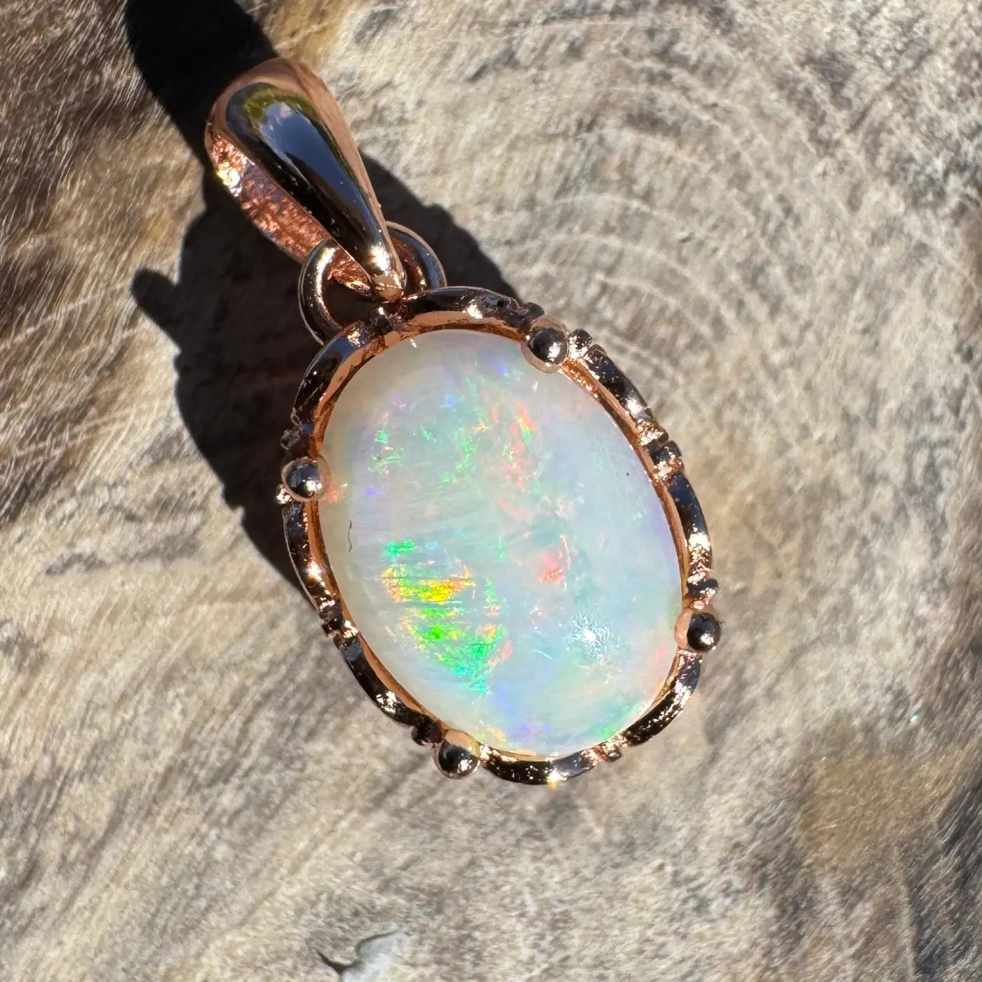 Oval Coober Pedy Opal pendant with rose gold setting in Larapinta Flame collection